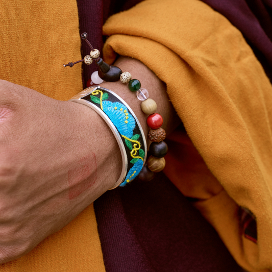 Qonga Still Bloom · Qiang Embroidery Silver Cuff –  Hand-Stitched Blue Floral Bracelet